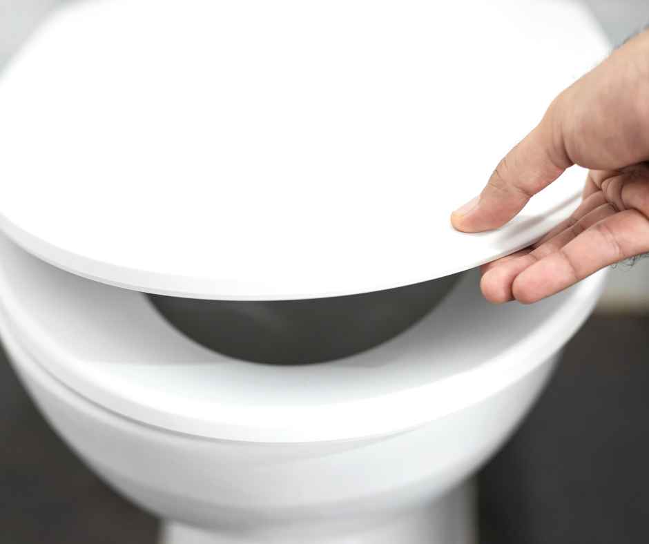 Lifting the lid to a toilet